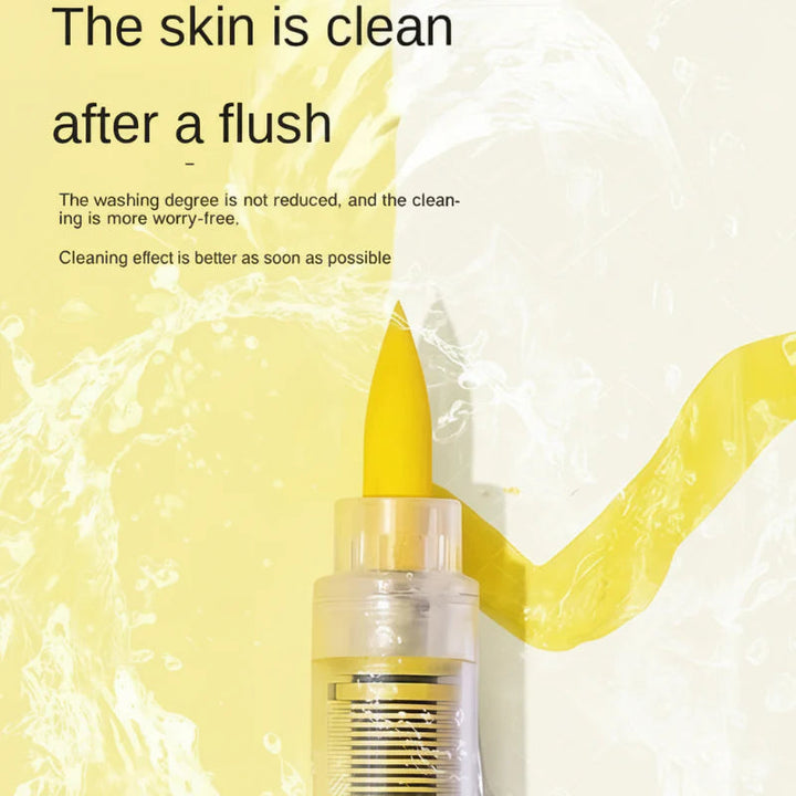 Close-up of a yellow acrylic brush marker tip against a water-splash background