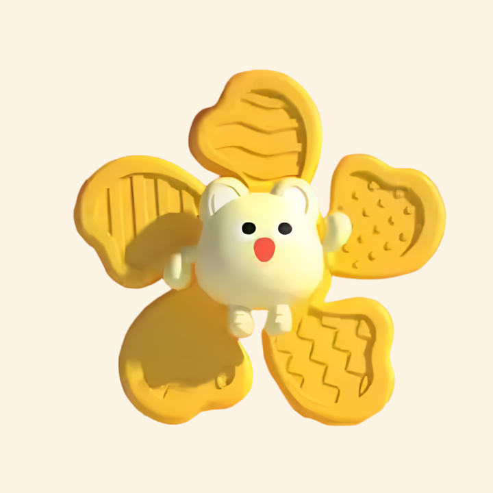 Yellow animal spinner with molded patterns on its arms