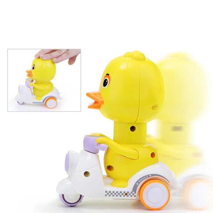 Yellow bird motorcycle toy with a hand pressing its head and a forward-motion effect