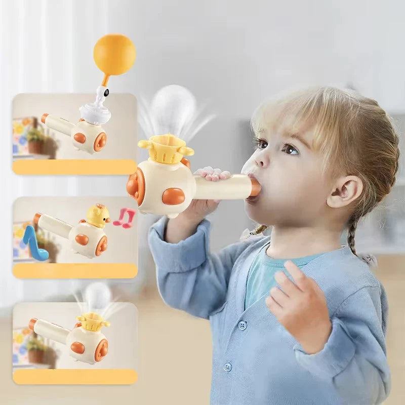 Child using a yellow blowing toy beside views of the balloon, chick-shaped head, and floating-ball activities.