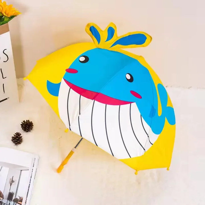 Yellow and blue whale umbrella with a smiling face and raised water-spout detail