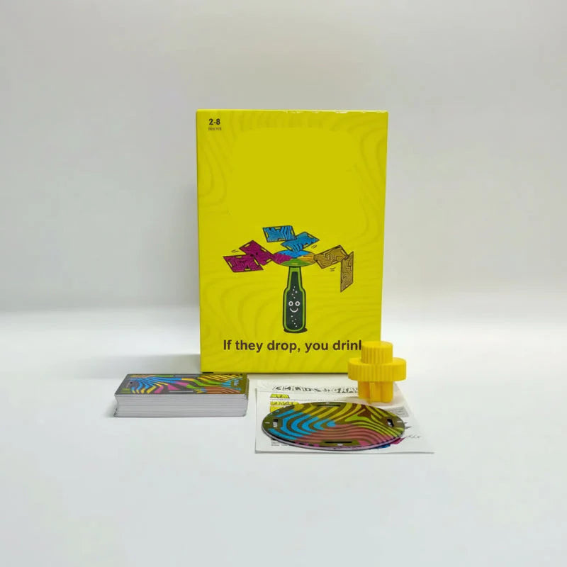 Yellow balance card game box with a card stack, circular disc, and yellow stopper.