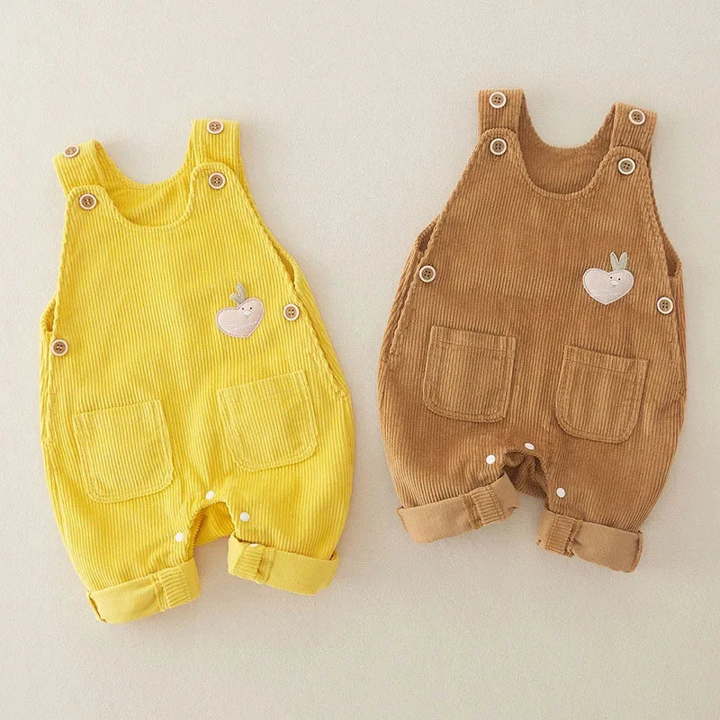 Yellow and brown baby overalls with front patch pockets and rolled cuffs