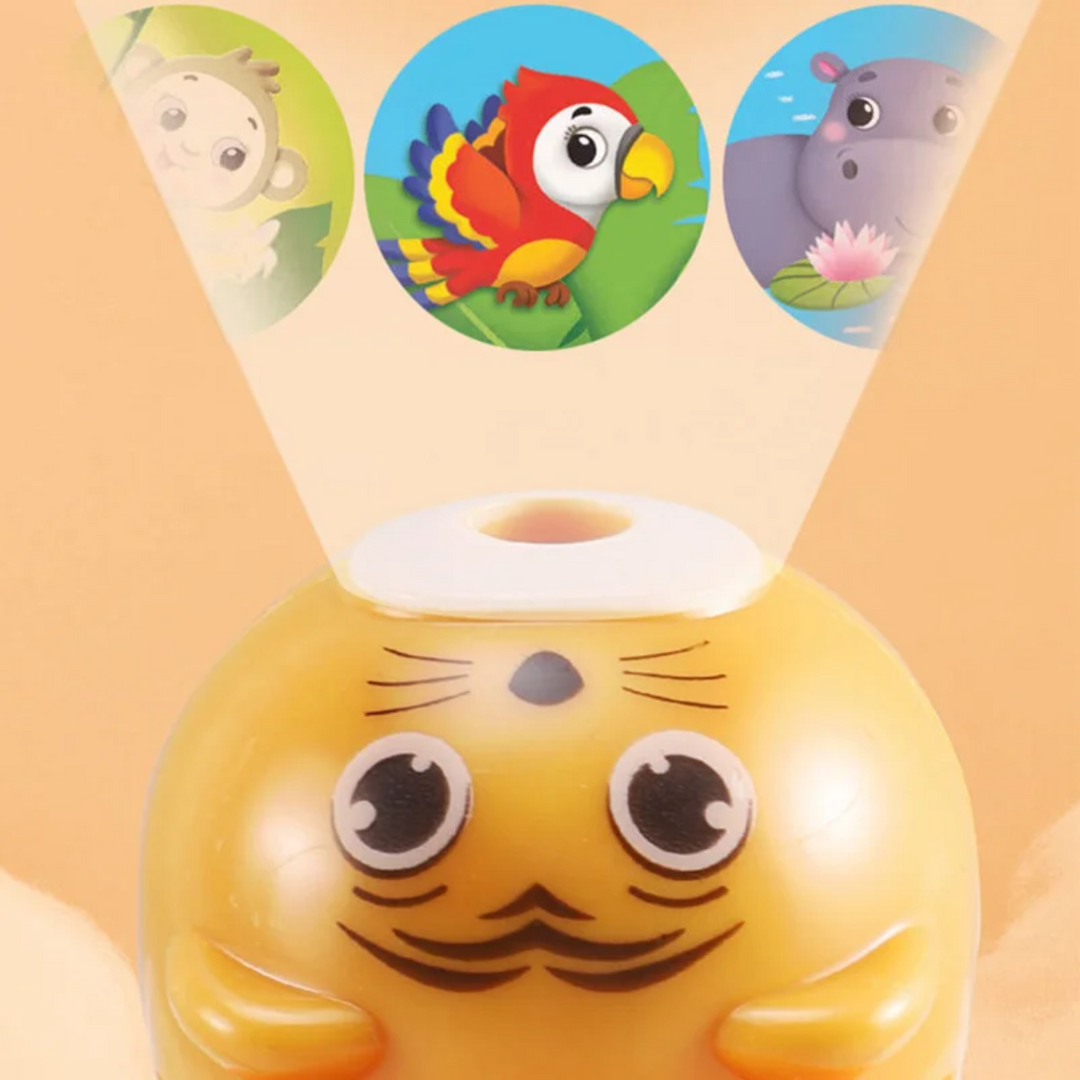 Close-up of a yellow cat-face projector flashlight with parrot and hippo pictures above it.