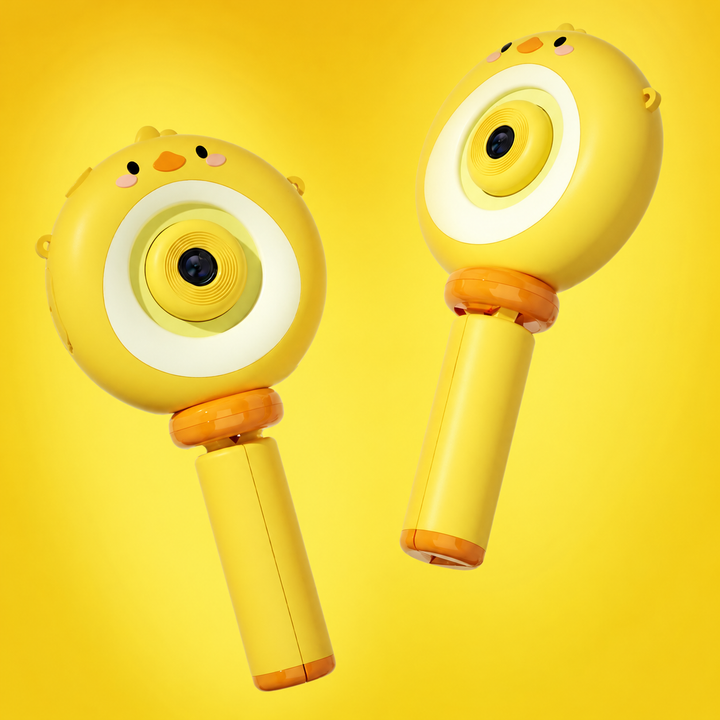 Two angled views of the yellow chick camera with its handle folded closed