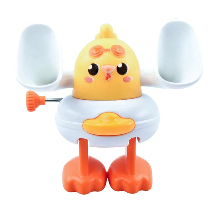 Yellow chick wind-up toy with white wings, orange feet, and a side winding key