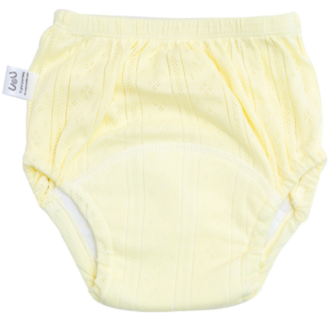 Pale yellow cotton training pants with elastic waist and leg openings.