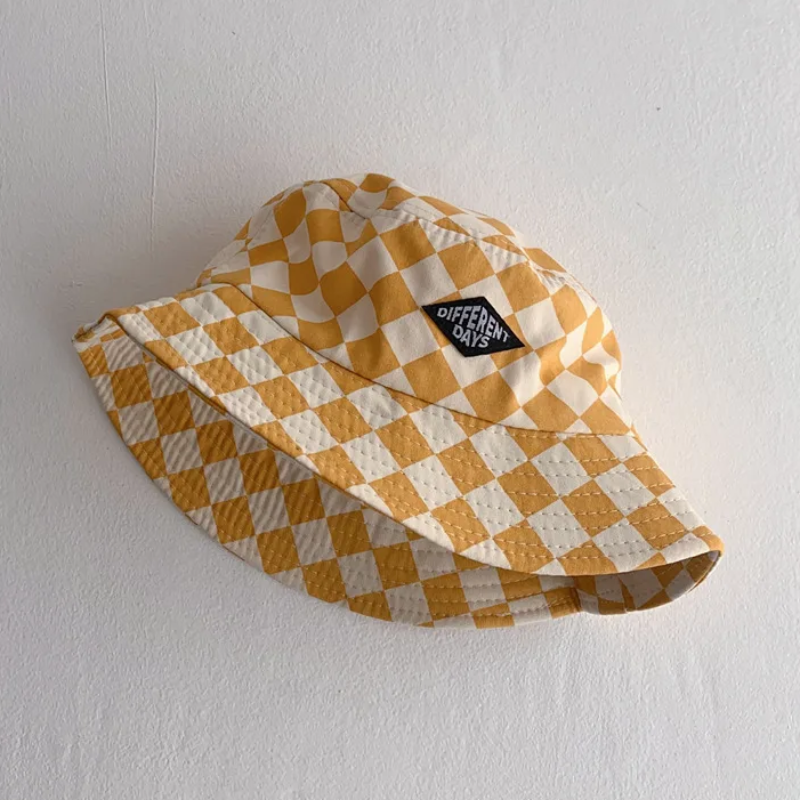 Yellow-and-cream checkered bucket hat with a stitched front patch