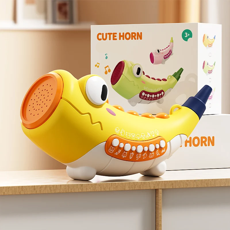 Yellow crocodile musical toy displayed with its retail box
