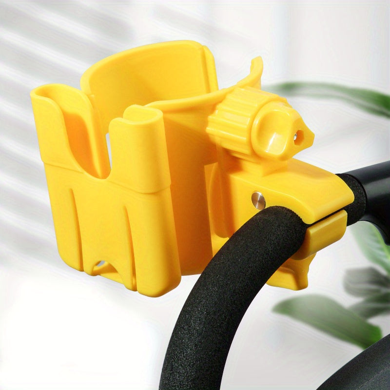 Yellow cup and phone holder clamped to a stroller handle.