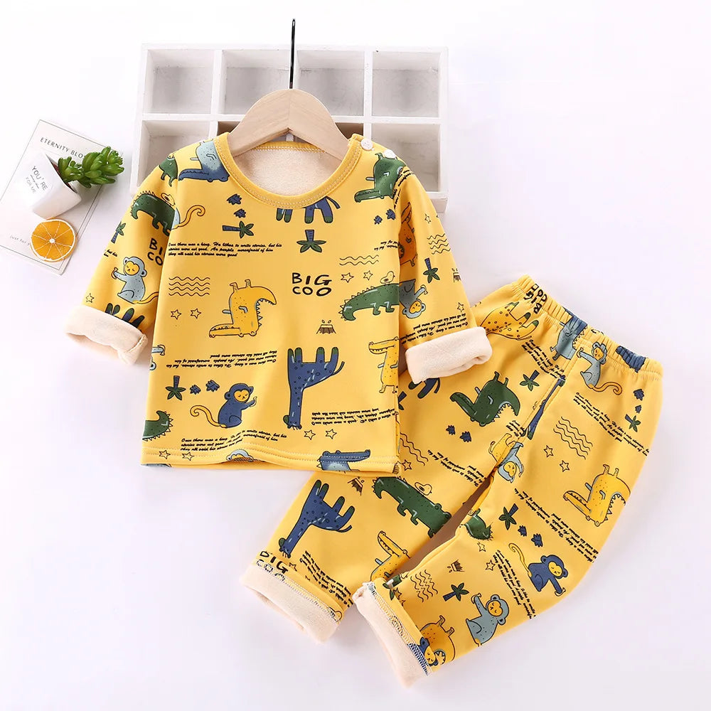 Yellow dinosaur-print fleece pajama top and matching pants with cream cuffs