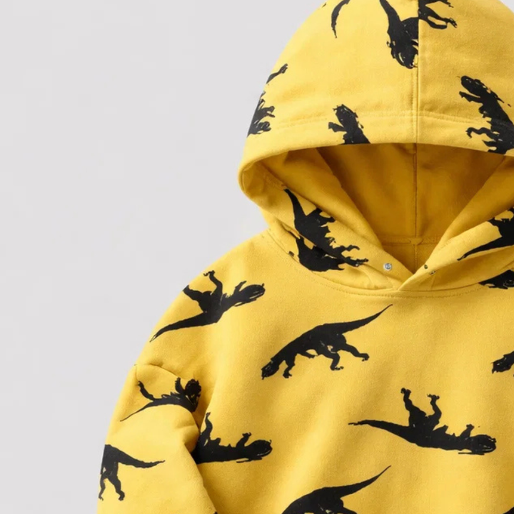 Close-up of the yellow dinosaur hoodie&