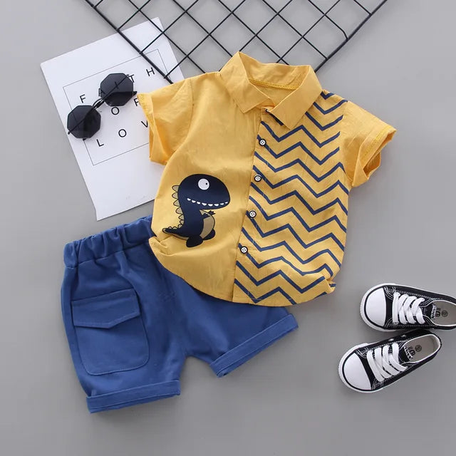 Yellow dinosaur shirt with blue zigzags and coordinating blue shorts