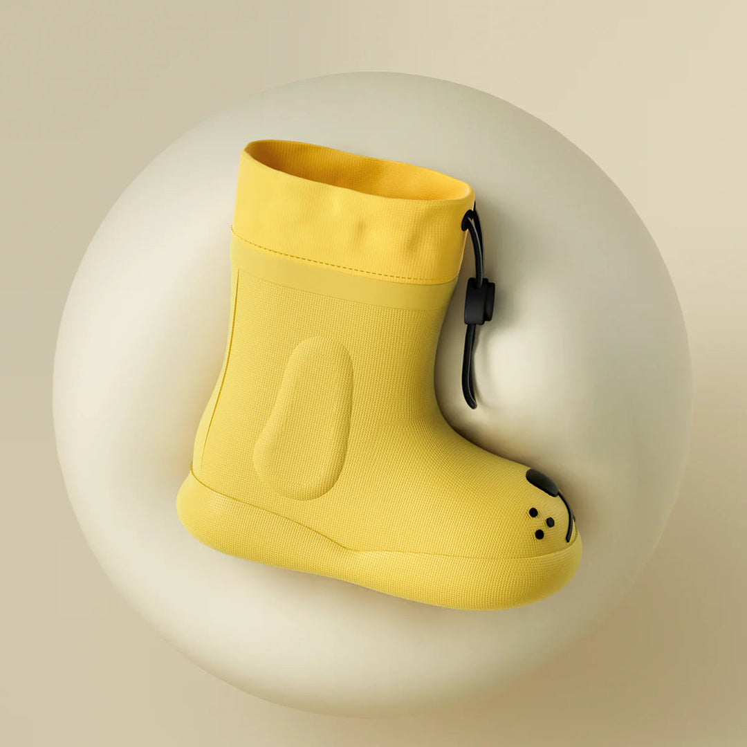 Side profile of a yellow dog-face rain boot with a drawcord cuff and raised side panel