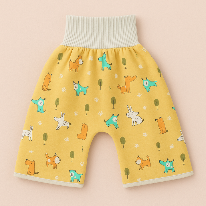 Yellow dog-print training pants laid flat with a wide white waistband