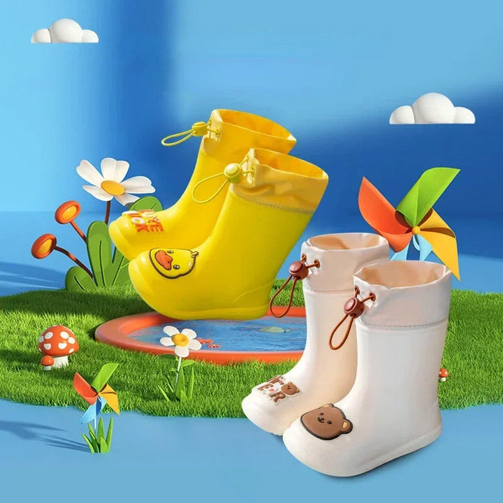 Yellow duck and beige bear rain boots in a colorful garden display