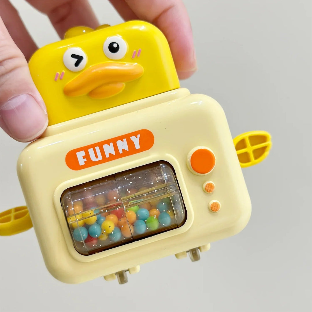 Hand holding a yellow duck toy car with colorful beads inside its clear front roller