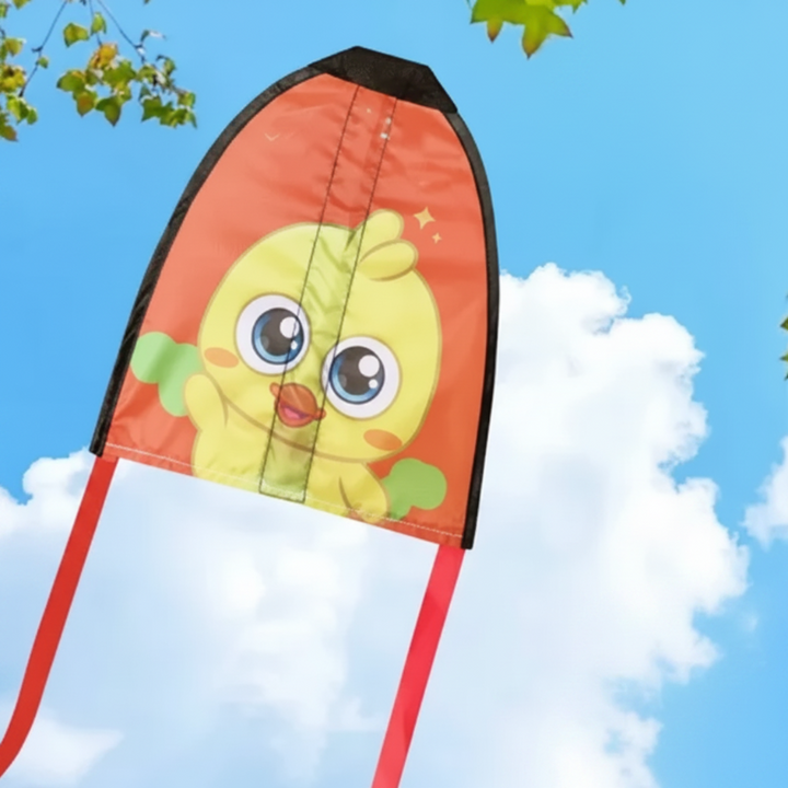 Yellow duck handheld kite with an orange background and red ribbon tails