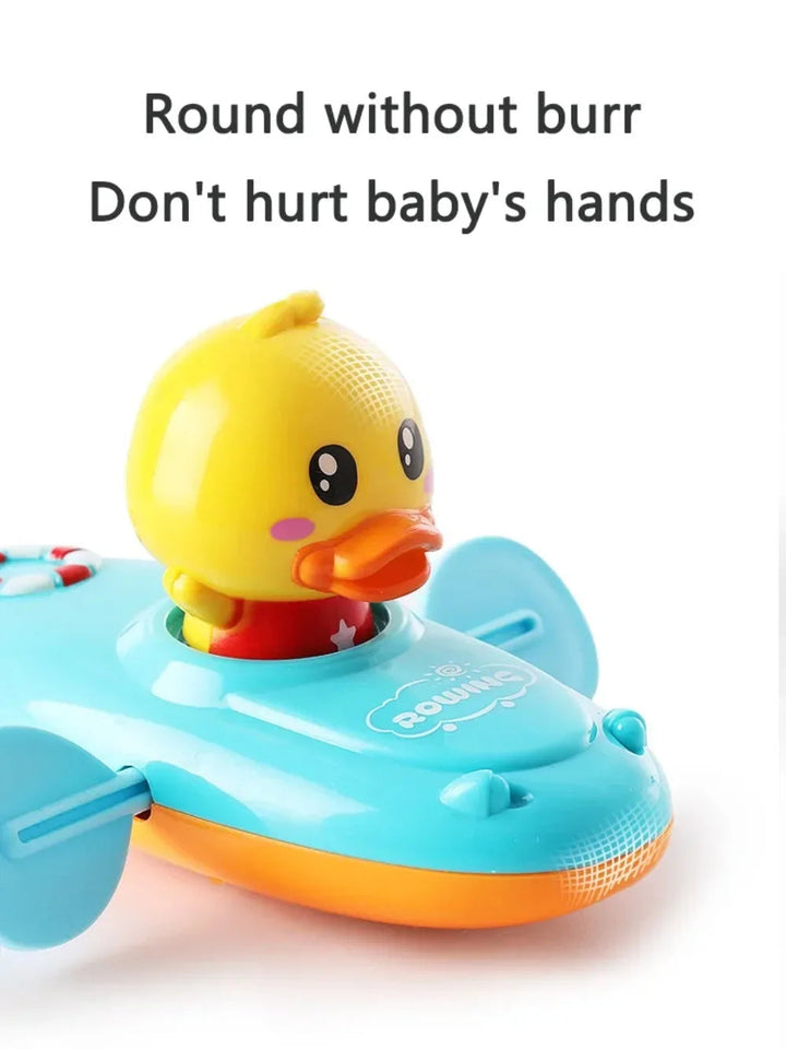 Close-up of the yellow duck seated in a blue bath boat with side paddles