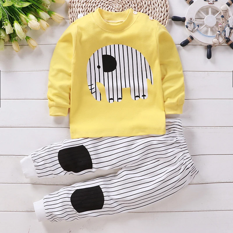 Yellow elephant pajama top paired with black-and-white striped long pants