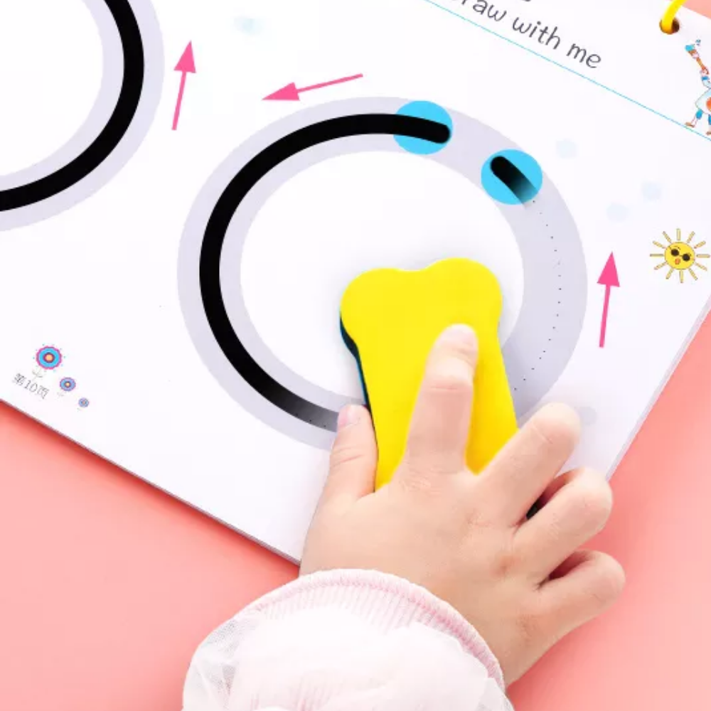 Child using a yellow eraser to remove black marker from a circular tracing exercise.