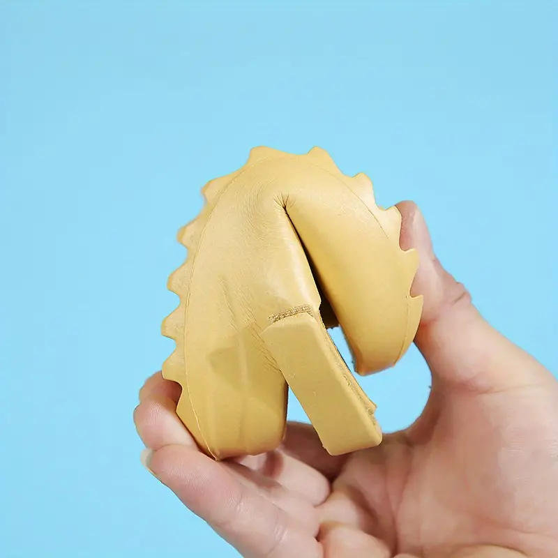 Yellow EVA foam sandal bent by hand to demonstrate its flexibility.