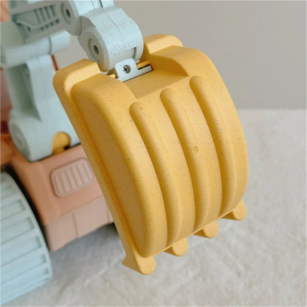 Close-up of the yellow excavator bucket and gray articulated arm