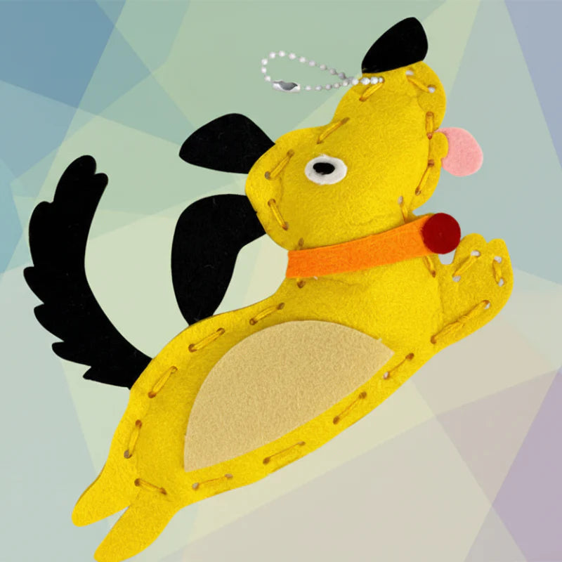 Yellow felt dog charm with stitched edges and a metal ball chain