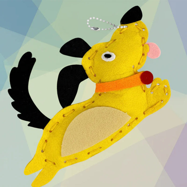 Yellow felt dog charm with stitched edges and a metal ball chain
