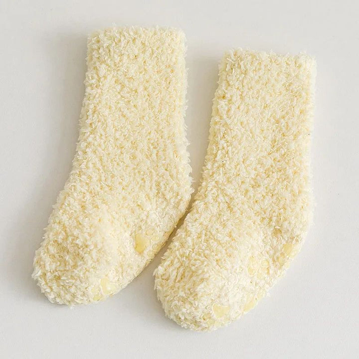 Yellow fleece socks displayed as a pair on a light background.