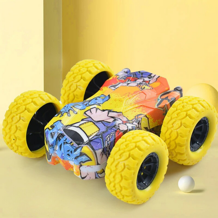 Yellow-wheeled toy car with colorful body graphics on a yellow background.