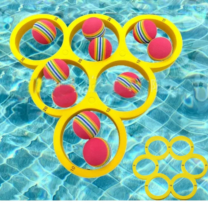 Yellow floating ring target and multicolored balls in a swimming pool