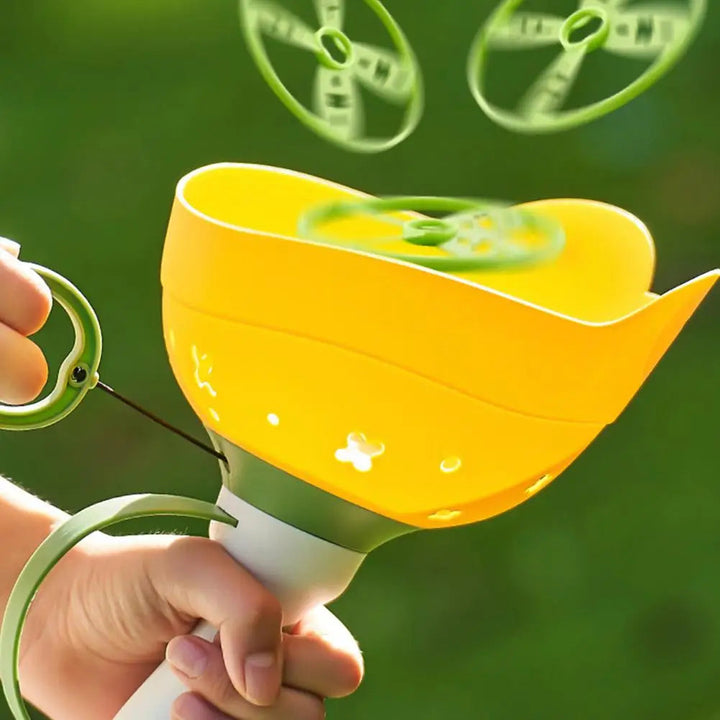 Yellow frog-shaped launcher with a loaded green disc and more discs in the air