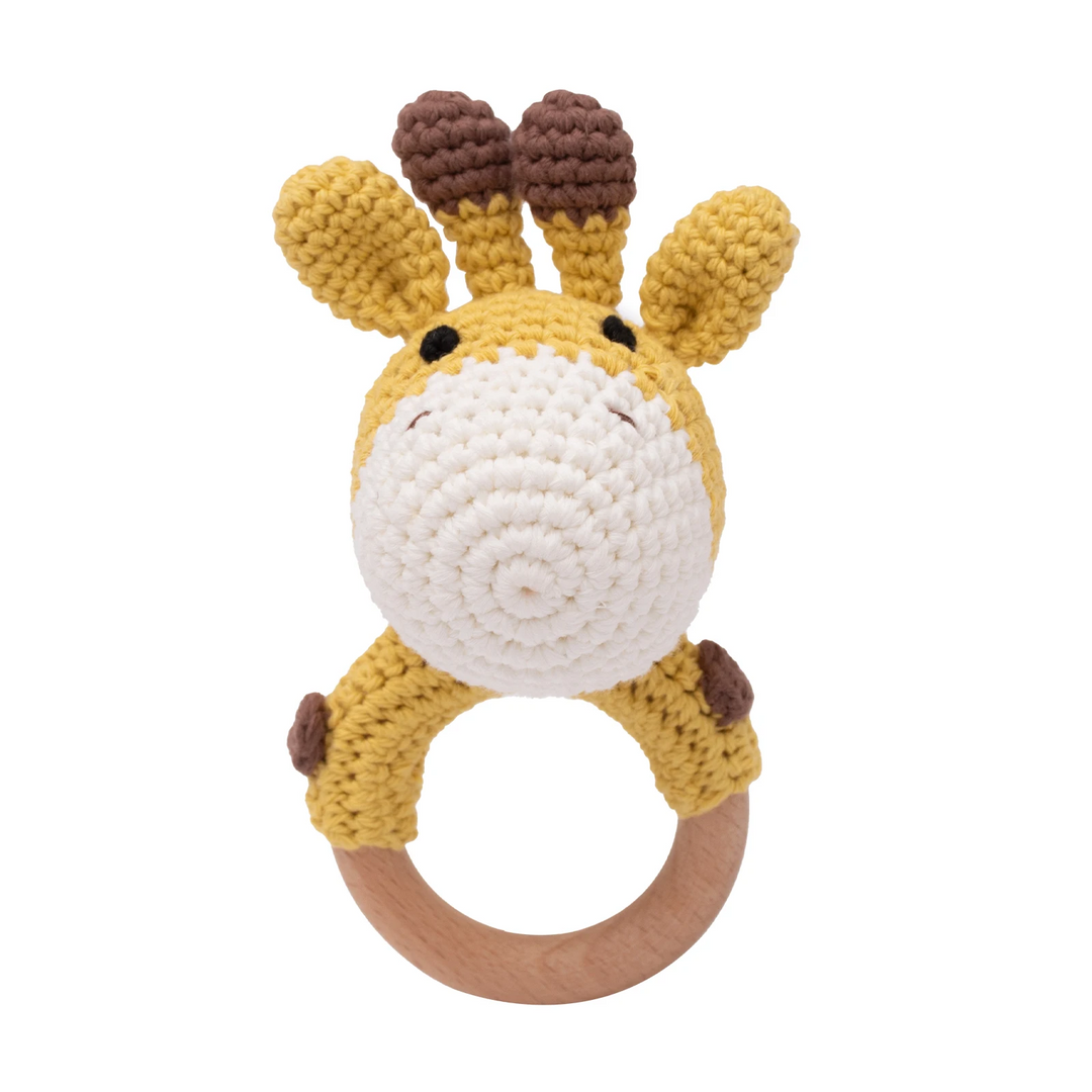Yellow crocheted giraffe baby rattle with brown horns and a wooden ring