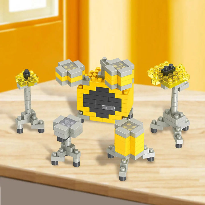 Yellow and gray miniature drum kit with block-built drums and cymbals