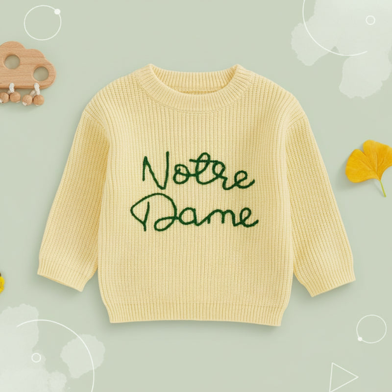 Front view of the yellow crewneck sweater with contrasting green lettering.