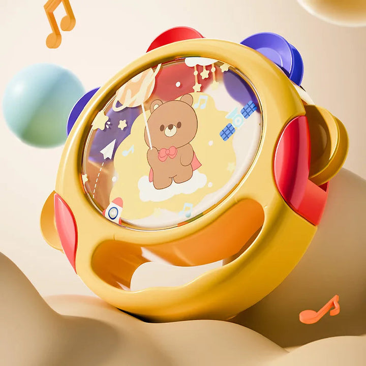 Yellow hand tambourine with colorful jingles and a bear-and-space drum face