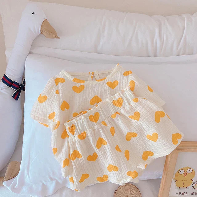 Yellow heart-print cotton outfit showing the short-sleeve top and gathered-waist shorts