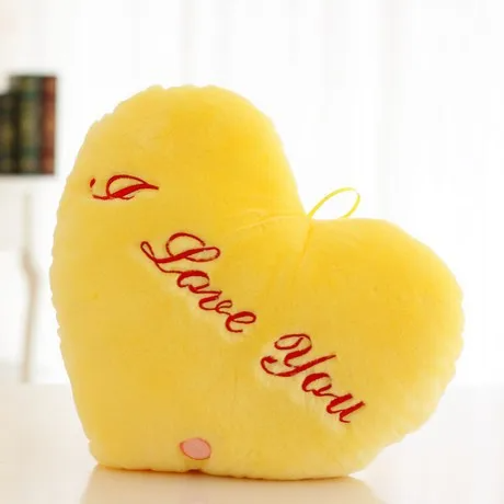Yellow heart-shaped plush pillow with red I Love You embroidery