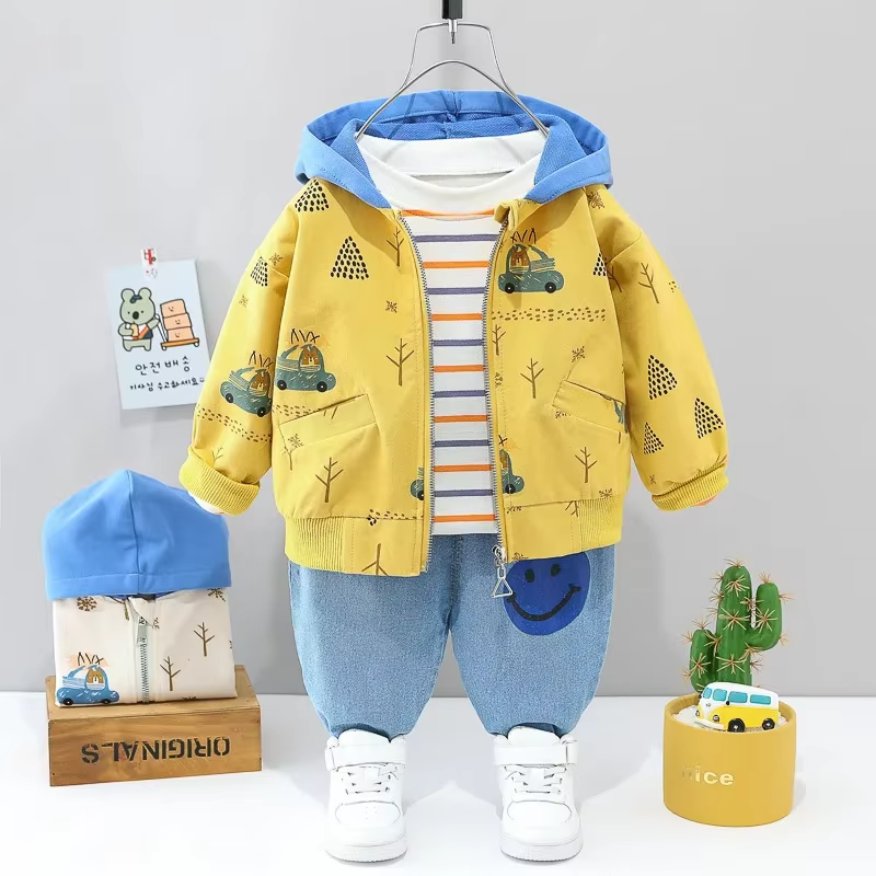 Yellow printed hooded jacket with a striped T-shirt and light blue pants