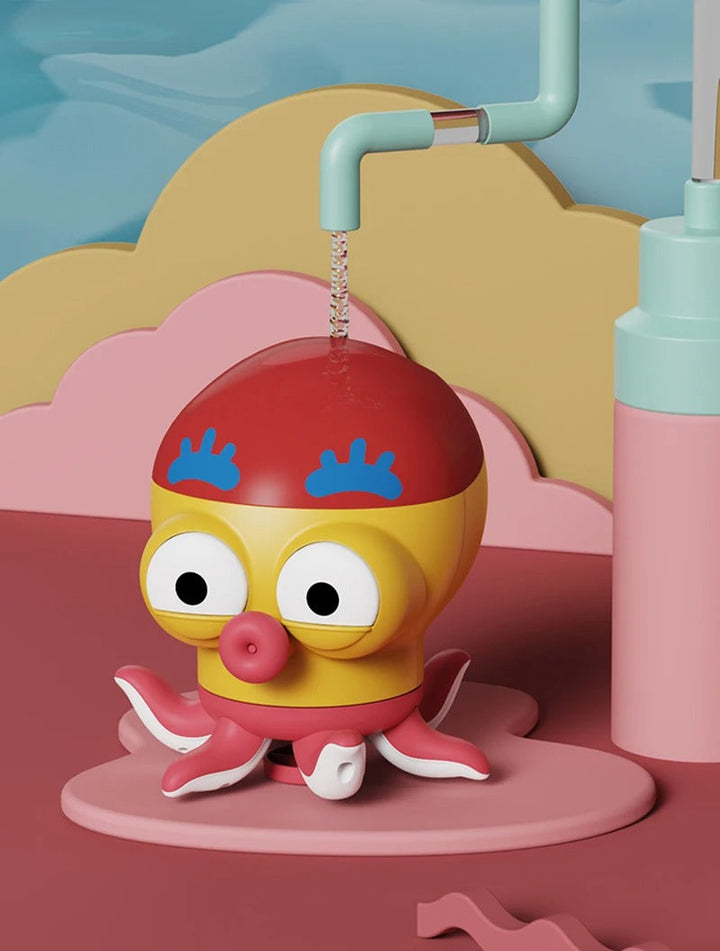 Yellow octopus bath toy beneath a running faucet