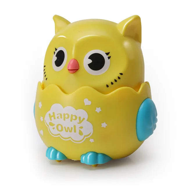 Yellow owl toy car with blue wings and feet and a pink beak.