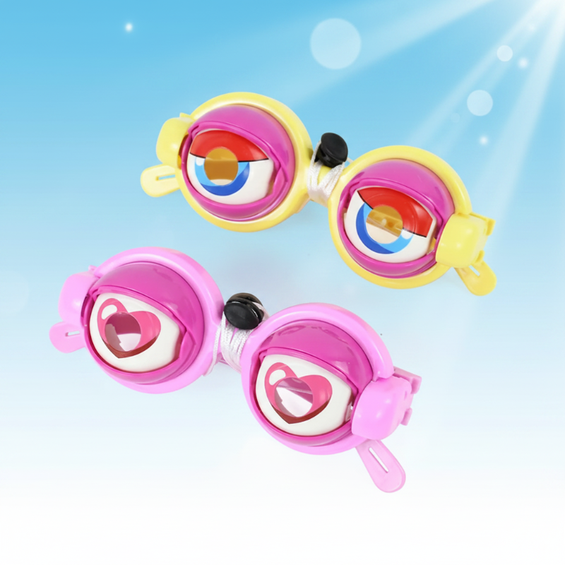 Yellow and pink toy glasses with oversized eyes against a blue background