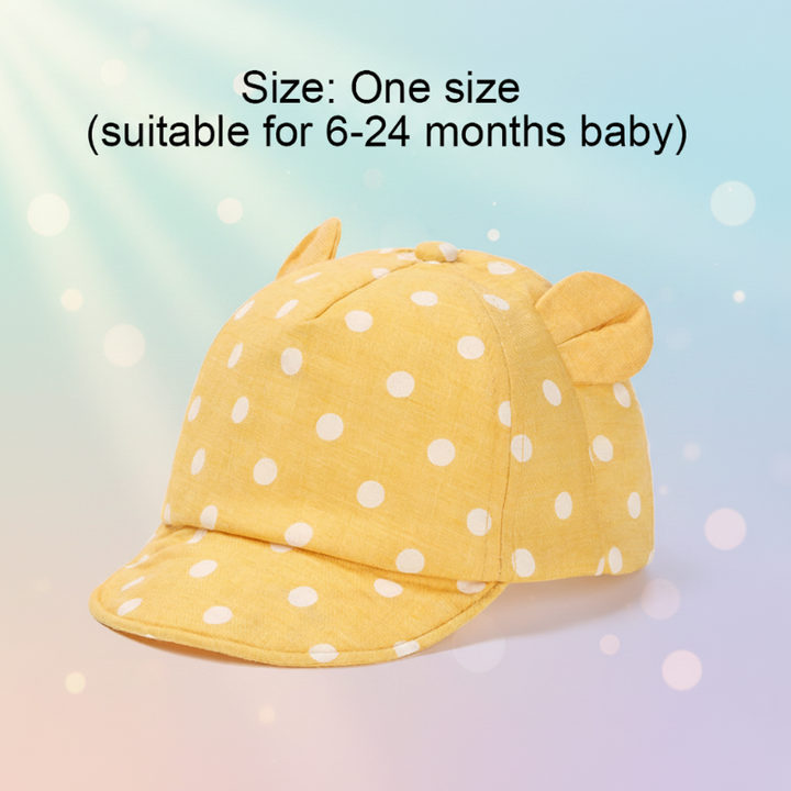 Yellow polka dot cap with a one-size label for ages 6–24 months.
