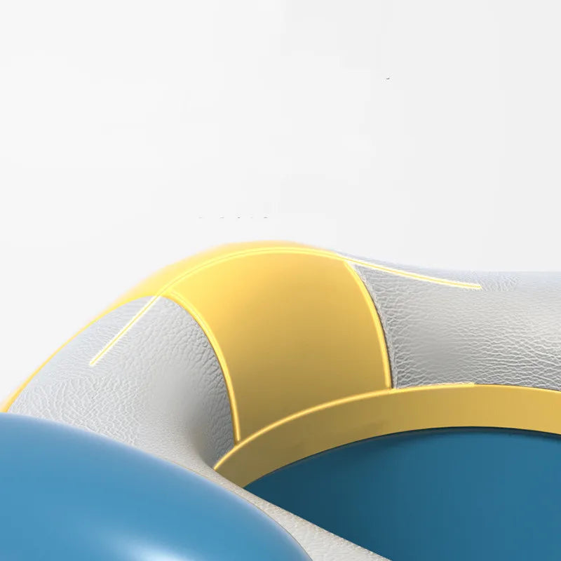 Close-up of the raised yellow splash guard and textured seat surface