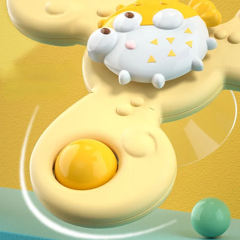 Close-up of the yellow pufferfish spinner with rounded arms and a raised character center