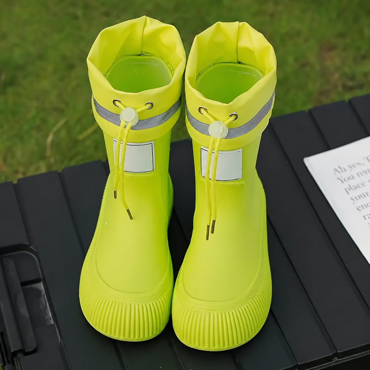 Yellow rain boots viewed from above, showing the openings and drawstring cuffs