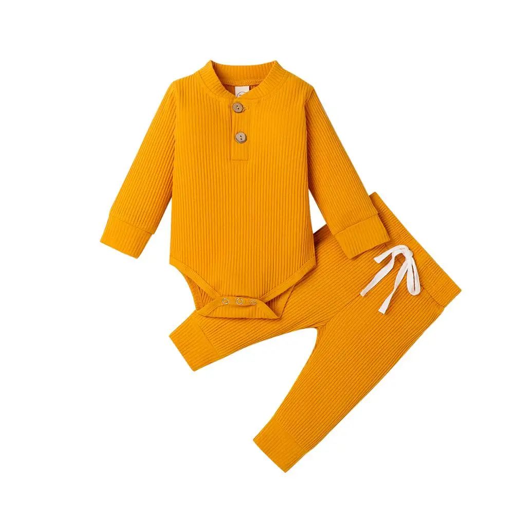 Yellow ribbed baby bodysuit and matching pants with neckline buttons and a white waist tie