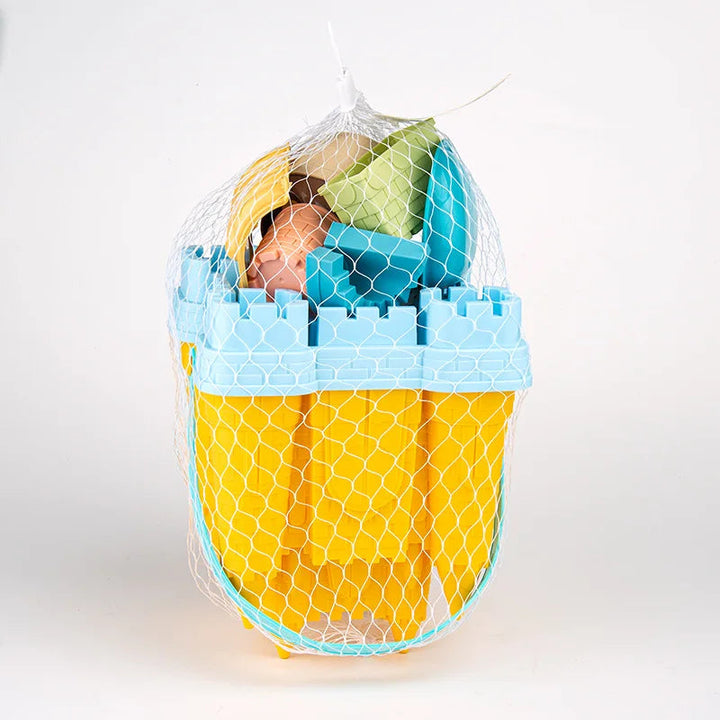 Yellow castle-shaped bucket packed with sand accessories in a white mesh bag