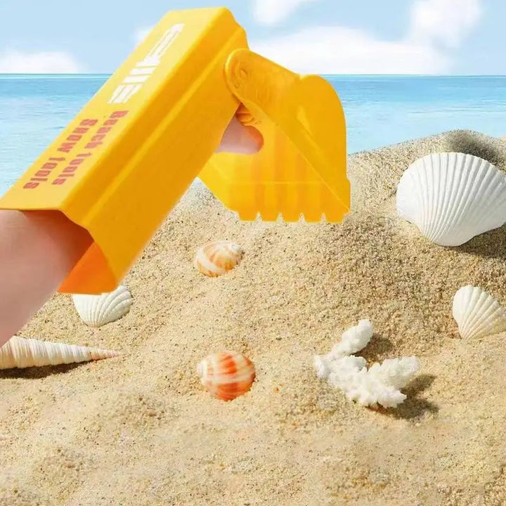 Yellow arm-style sand grabber held above beach sand and seashells